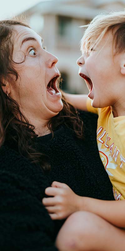A stressed woman and child shouting to help release their anxiety