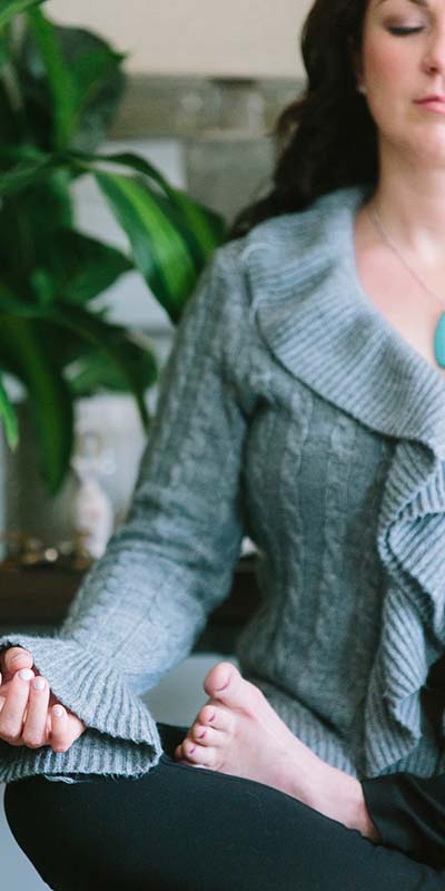 A woman practicing mindfulness to keep stress and anxiety from impacting her professional and personal life