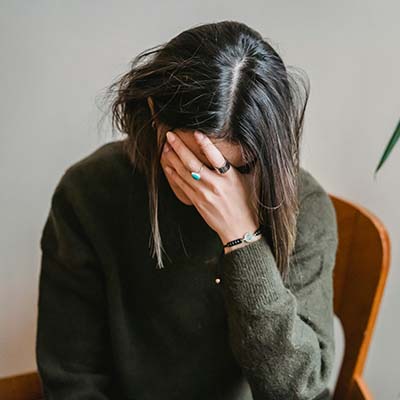 Stress affecting a woman's executive functioning skills and causing overwhelm
