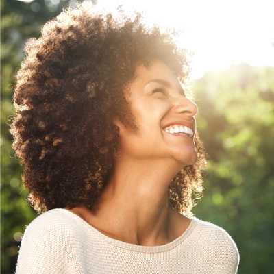 A Black woman is happier and more confident after using supportive constraints to help introduce good habits to support her executive functioning challenges A Black woman is happier and more confident after using supportive constraints to help introduce good habits to support her executive functioning challenges