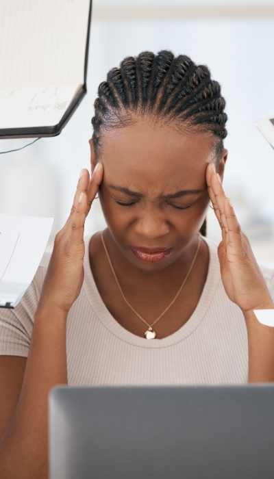 A woman overwhelmed with juggling a busy life A woman overwhelmed with juggling a busy life