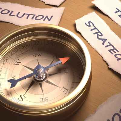A compass pointing to strategy used to illustrate how being proactive can help you stay focused and reach your goals with better life balance A compass pointing to strategy used to illustrate how being proactive can help you stay focused and reach your goals with better life balance