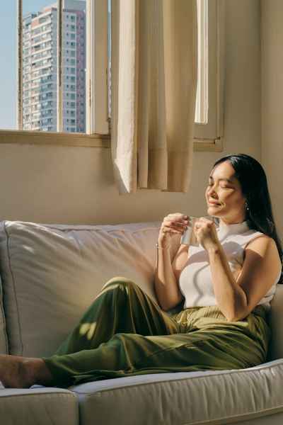A woman pauses for a mindful breathing moment so she can regulate and make proactive task choices A woman pauses for a mindful breathing moment so she can regulate and make proactive task choices