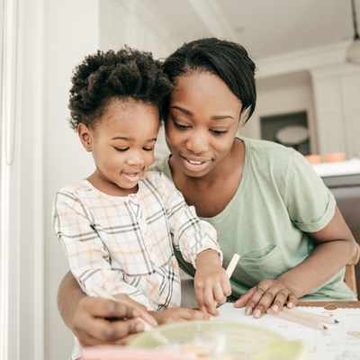 A mother helps her toddler and stays open to how their needs may be different A mother helps her toddler and stays open to how their needs may be different