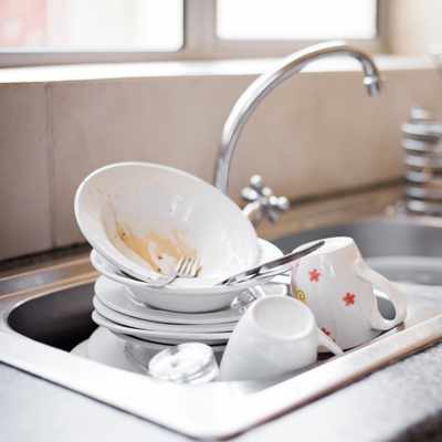Dirty dishes piled in a sink can cause arguments at home but with communication tools like Nonviolent Communication (NVC) it can be a conversation
