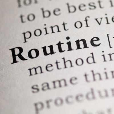 Routine in the dictionary shown close up to highlight the importance of morning routines